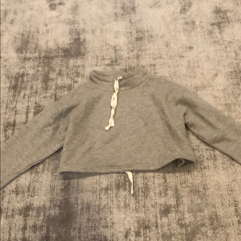 Long sleeve, soft cropped sweater with mock neck.